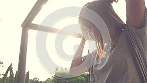 Beautiful young asian woman listening to music on a smart phone in the city. Young asian woman relaxing listening to music.