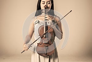 Beautiful young asian woman playing violin