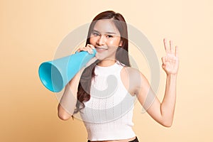 Beautiful young Asian woman show OK announce with megaphone