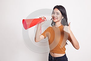 Beautiful young Asian woman show thumbs up announce with megaphone.