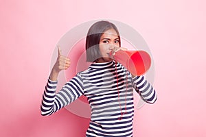 Beautiful young Asian woman show thumbs up announce with megaphone.