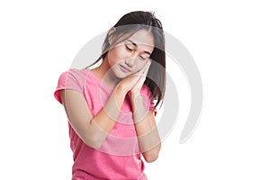 Beautiful young Asian woman with sleeping gesture