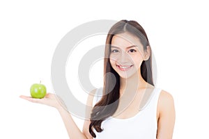 Beautiful young asian woman smile and holding green apple fruit with wellness and healthy isolated