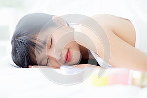 Beautiful of young asian woman smiling and lying on bed at bedroom, beauty of girl with hygiene and healthy.