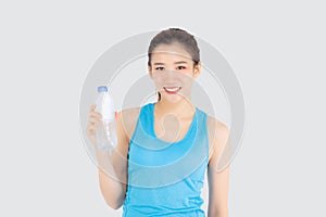 Beautiful young asian woman in sport after workout drinking water from bottle for thirsty isolated on white background, asia girl