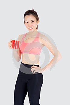 Beautiful young asian woman in sport after workout drinking water from glass for thirsty isolated on white background