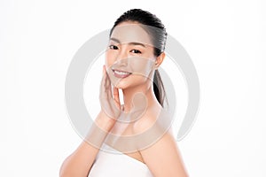 Beautiful young  asian woman touching her clean face with fresh healthy skin, isolated on white background, beauty cosmetics and