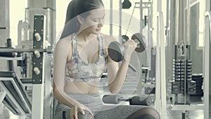Beautiful young asian woman training workout with strong at gym, asia girl bodyweight with lifting dumbbell at fitness