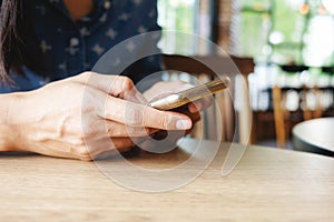 Beautiful young asian woman using smartphone and holding card for shopping online payment . Shopping concept with copy space. Onli