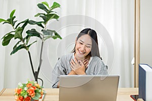 Beautiful young asian woman using video conference call to people,Work from home,Work at home photo