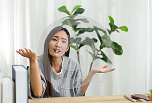 Beautiful young asian woman using video conference call to people,Work from home,Work at home photo