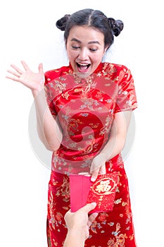 Beautiful Young asian woman wearing chinese dress traditional cheongsam. Received red envelope. Surprise and happy smile.