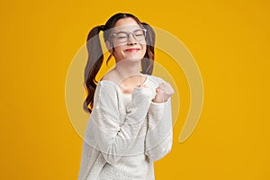 Beautiful young asian women feel happiness with positive expression, joyful on Yellow background. Happy adorable glad woman