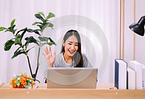 Beautiful young asian woman using video conference call to people,Work from home,Work at home photo