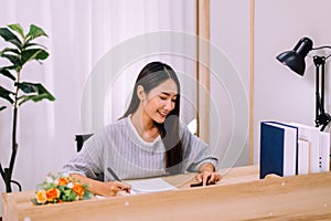 Beautiful young asian woman using video conference on mobile to people,Work from home,Work at home photo