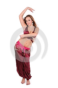 Beautiful young belly dancer in red costume