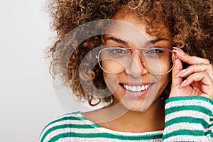 Beautiful young black woman smiling with glasses