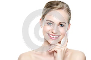 Beautiful young blond smiling woman with clean skin, natural make-up and perfect white teeth