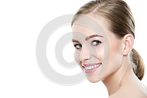 Beautiful young blond smiling woman with clean skin, natural make-up and perfect white teeth