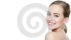 Beautiful young blond smiling woman with clean skin, natural make-up and perfect white teeth