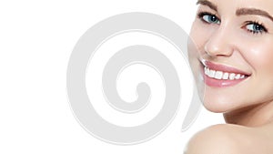 Beautiful young blond smiling woman with clean skin, natural make-up and perfect white teeth, on white background