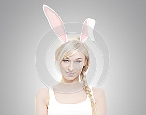 Beautiful young blond woman as easter bunny