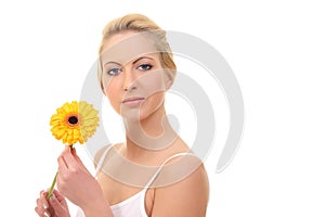 young blond woman with a flower in her hands