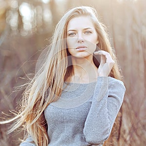 Beautiful young blond woman outdoors portrait