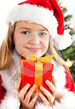 Beautiful young blonde girl holds present