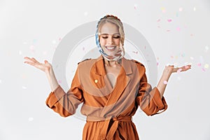 Beautiful young blonde pretty woman wearing silk scarf posing isolated over white wall background over konfetti photo