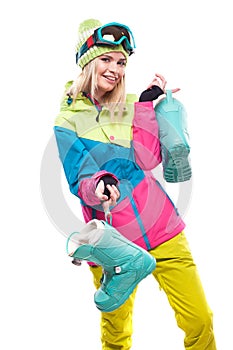 Beautiful young blonde woman in colorful snow coat hold snow boo