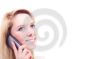 A beautiful young blonde woman making a phone call with copy space