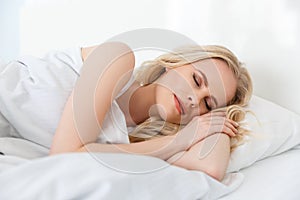 beautiful young blonde woman sleeping