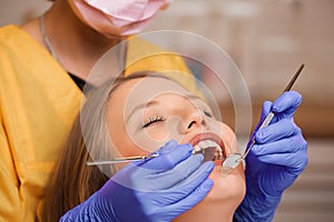 Beautiful young blonde women at dentist