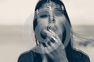 Beautiful young boho style woman portrait outdoors. black and white. double exposure
