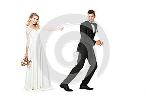 beautiful young bride with chain and leashed groom