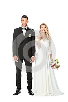 beautiful young bride with chain and leashed groom looking at camera