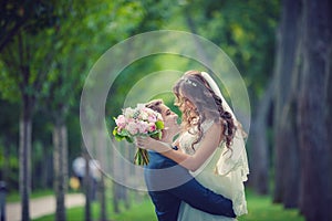 Beautiful young bride and groom going to kiss