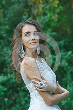 Beautiful young bride with long curly hair