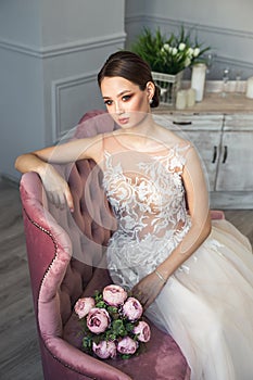 Beautiful young bride with wedding makeup, jewelry, luxury hairstyle