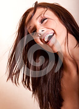 Beautiful young brunette woman laughing