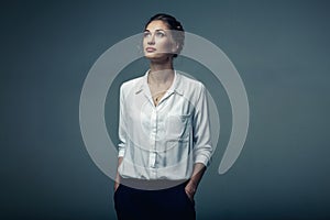 Beautiful young buisness woman in studio photo