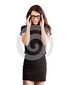 Beautiful young business smiling woman standing in black office formal clothing and holding hands the eye glasses on isolated on