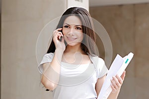 Beautiful young Business woman with movil
