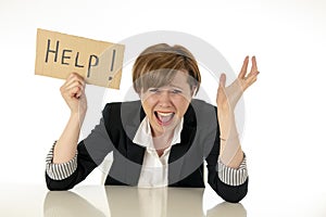 Beautiful young business woman overwhelm and desperate holding a help sign