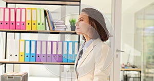 Beautiful young business woman thinking looking out window