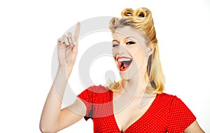 Beautiful young businesswoman pinup retro vintage hair style pointing you while standing against white grey background