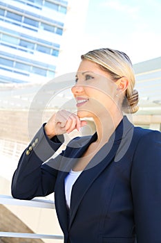 Beautiful young businesswoman thinking