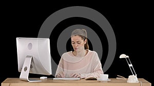 Beautiful young casual woman wearing headset working on computer, Alpha Channel