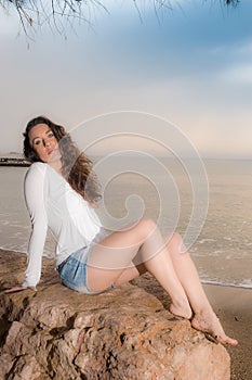 Beautiful young caucasian girl at the beach